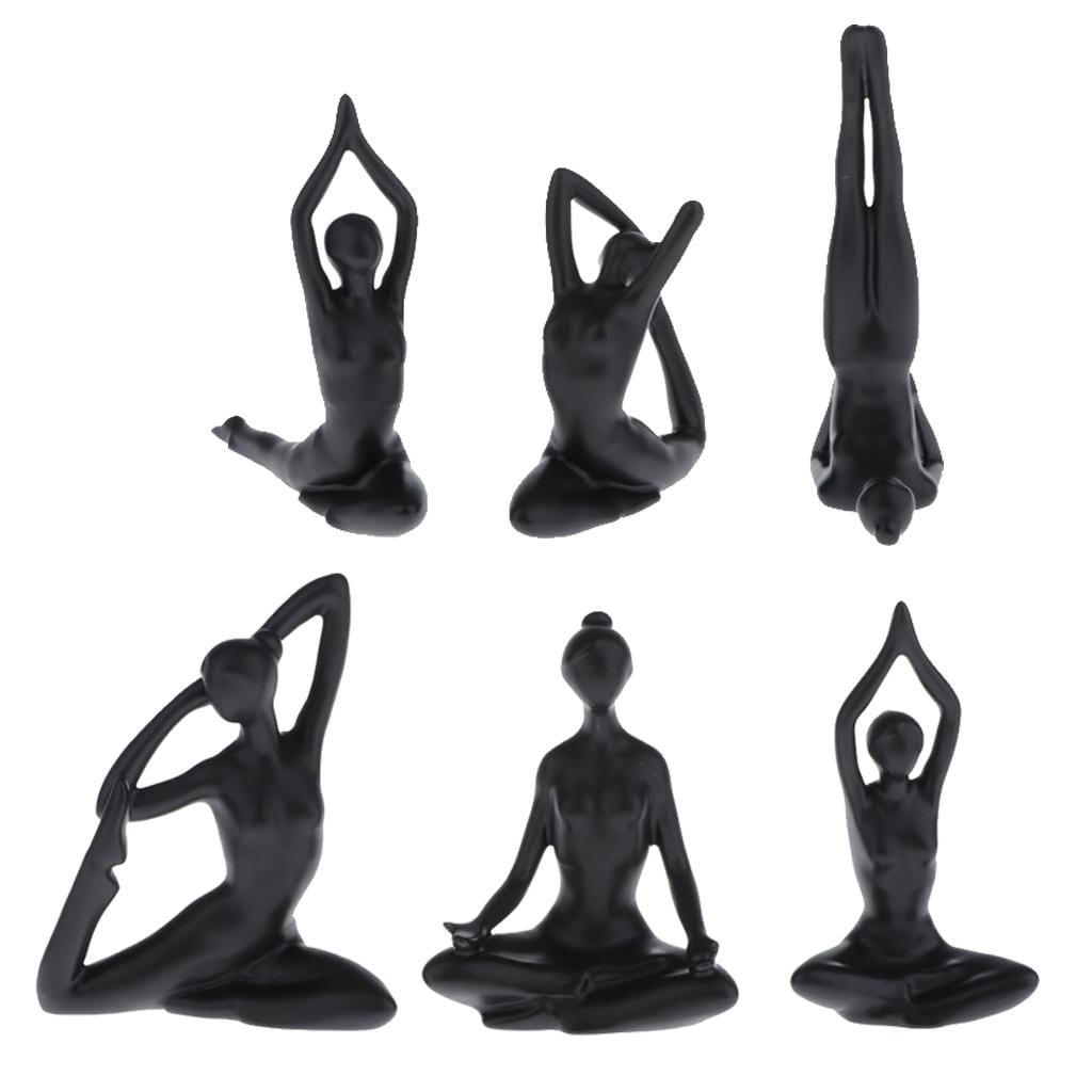 Set of six glossy black resin yoga figurines in various meditative poses for decorative use.