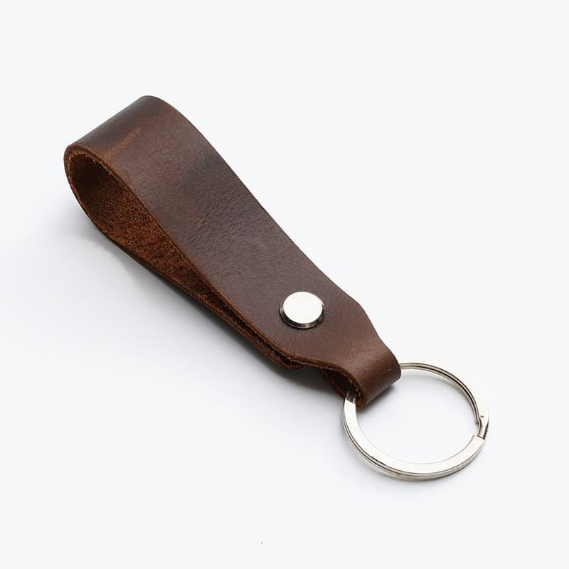 Brown leather car keychain set featuring a genuine lanyard key holder with a silver-toned metal ring and a single circular rivet.