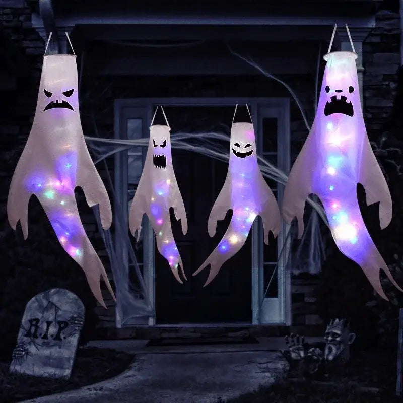 Four glowing translucent white halloween ghost led hanging windsocks with illuminated purple and blue lights for home outdoor decoration.