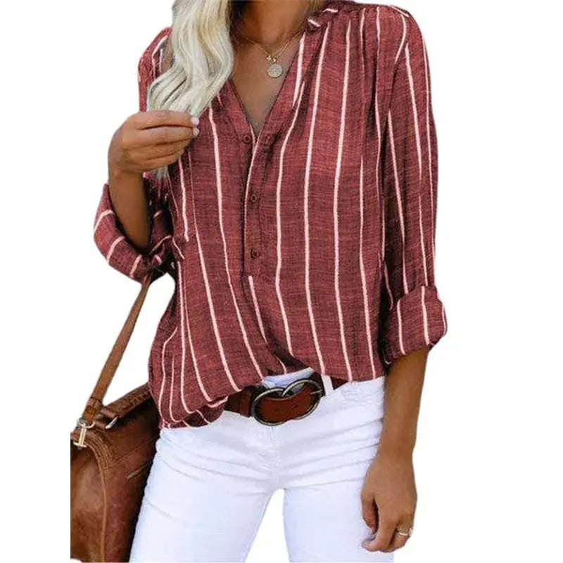 A maroon and white vertically striped button up shirt for women made of cotton polyester with rolled sleeves from mainland china.