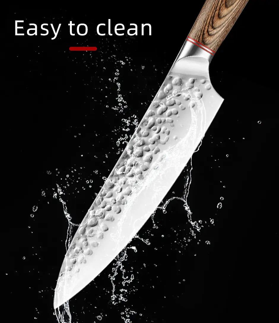 A sleek forged stainless steel chef knife set featuring a hammered blade with a wooden handle and red accent ring.