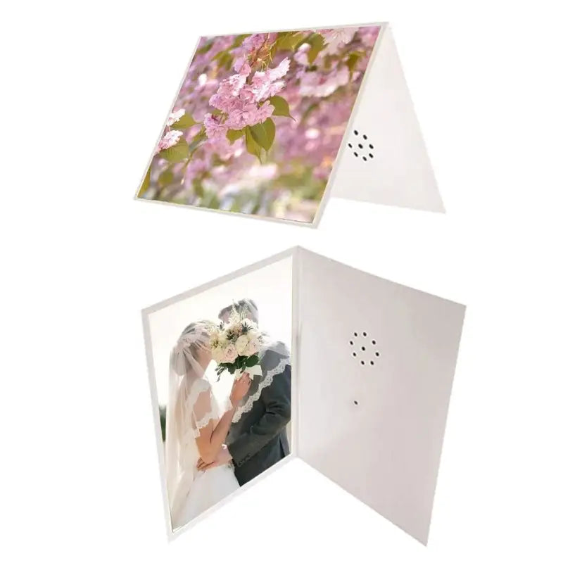 A white foldable recordable voice greeting card with a printed image of pink blossoms on the front and a bride and groom kissing inside designed for weddings.