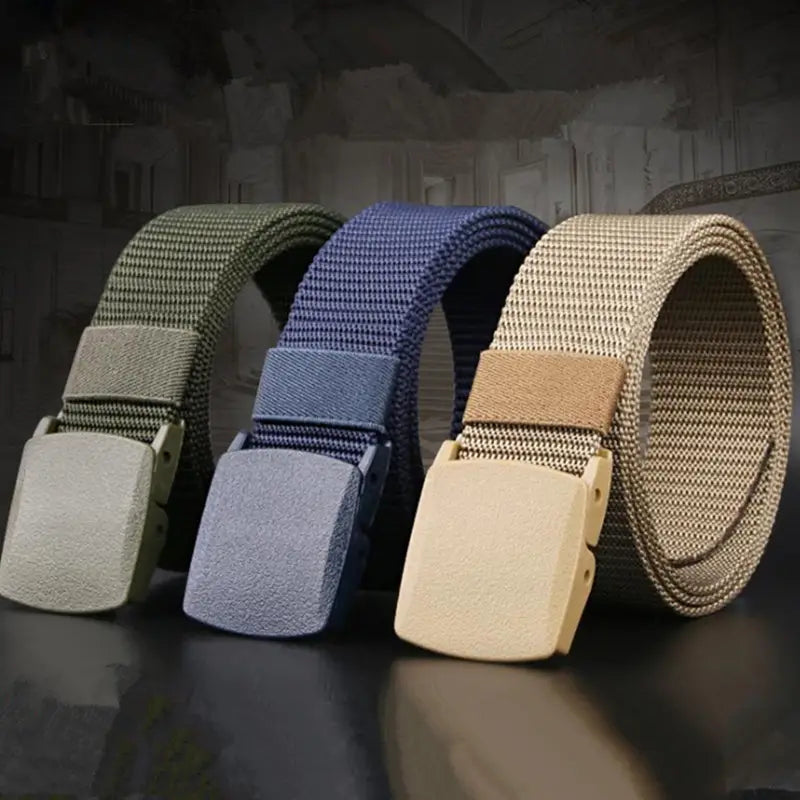 three tactical canvas belts in olive green navy blue and tan with adjustable textured plastic buckles for men outdoor waistband use