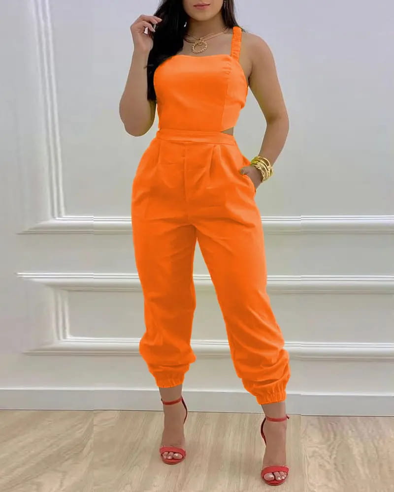 Bright orange sleeveless women summer printed cutout jumpsuit with a fitted bodice side cutouts and cuffed pant legs.