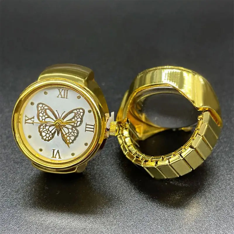 Gold butterfly watch ring made of stainless steel featuring a white face with roman numerals and a cute jewelry design.