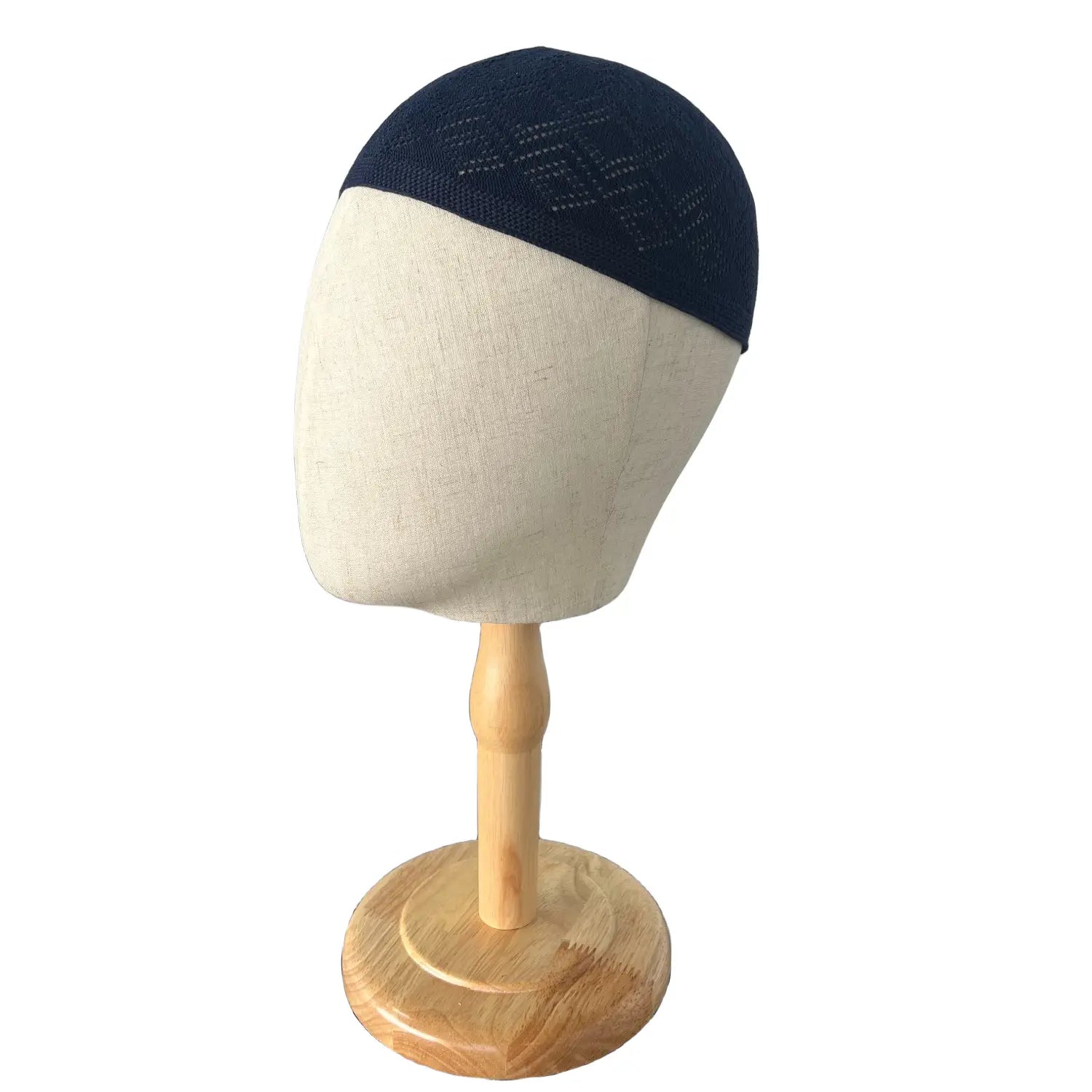 Navy blue knitted kufi beanie prayer cap featuring a subtle geometric pattern in soft yarn material.