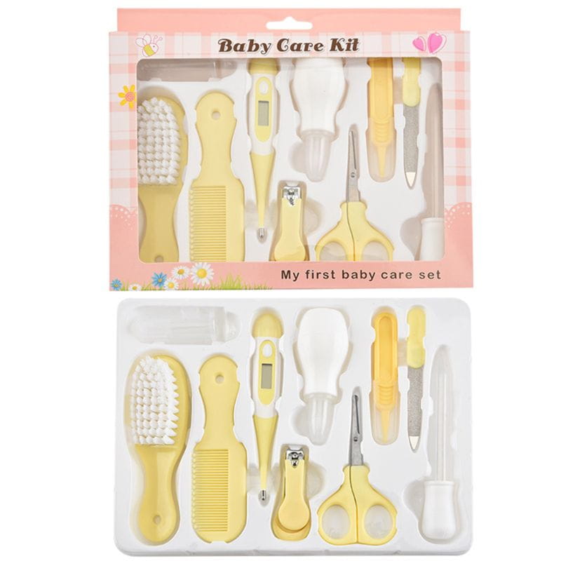 Gelbes Kunststoff-Baby-Gesundheits- und Pflege-Set mit weißen Borsten und Griffen, einschließlich digitalem Thermometer, Schere, Kamm, Bürste, Nagelclipper sowie weiteren Werkzeugen für die Babypflege.