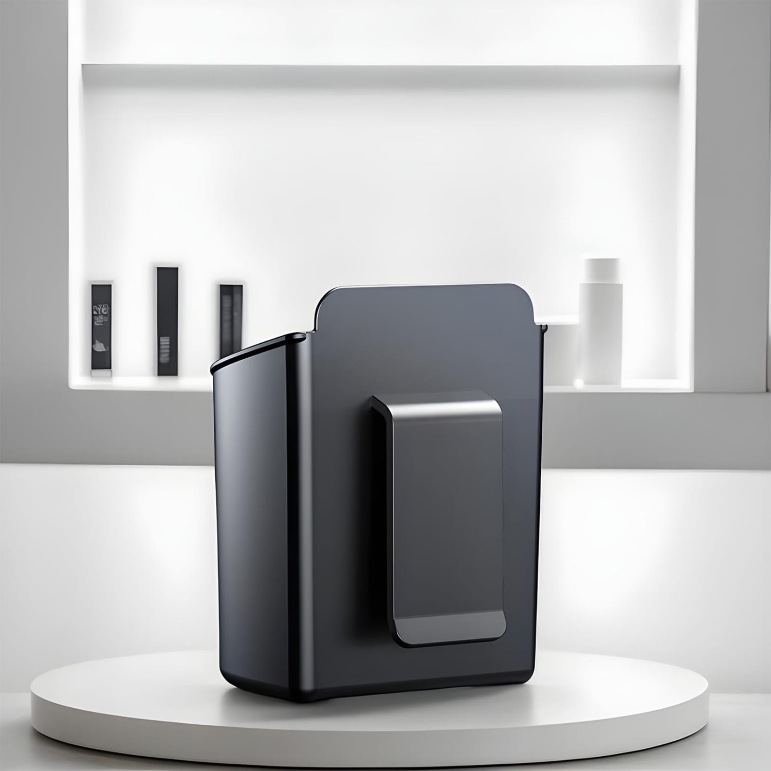 Black rectangular wall-mounted trash bin with a sleek metallic clip on the front designed as a car door cup holder for vehicles.