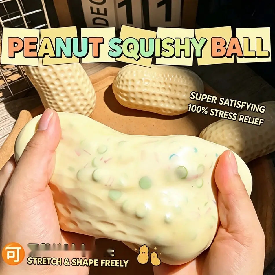 a creamy beige peanut squishy filled stress toy with a textured pebbled surface and embedded green and blue speckles