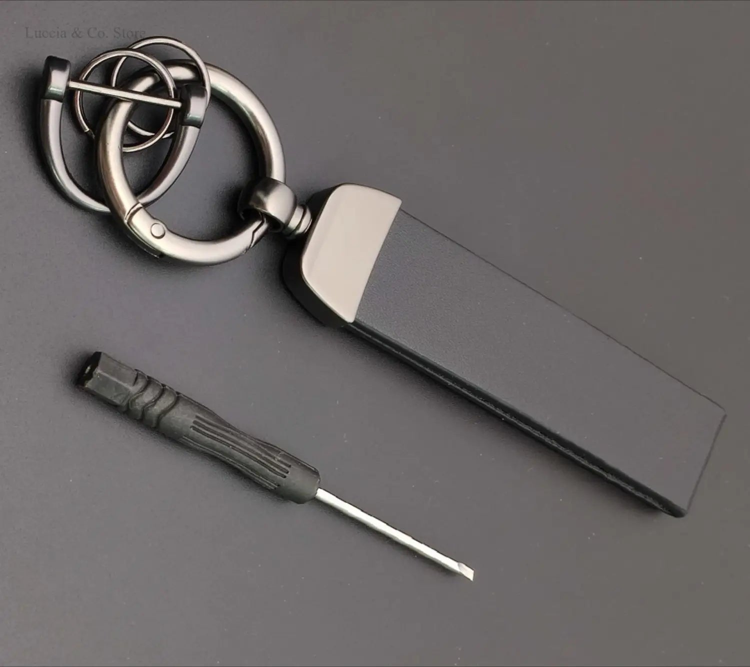 Black leather keychain with silver metal clasp and rectangular tag for custom logo car keychain personalized metal leather ring.