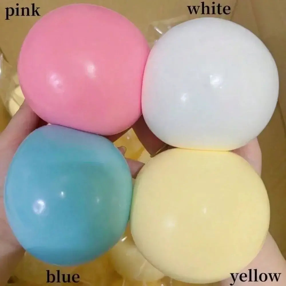 un conjunto de cuatro pelotas blandas y esponjosas de colores pastel en rosa, blanco, azul y amarillo, con superficies lisas para aliviar el estrés y la ansiedad