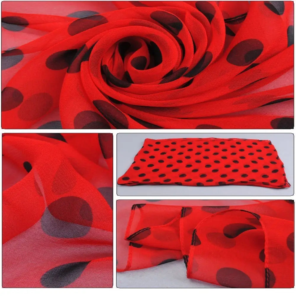 A sheer red polka dot silk head wrap scarf with bold black dots and lightweight flowing fabric.