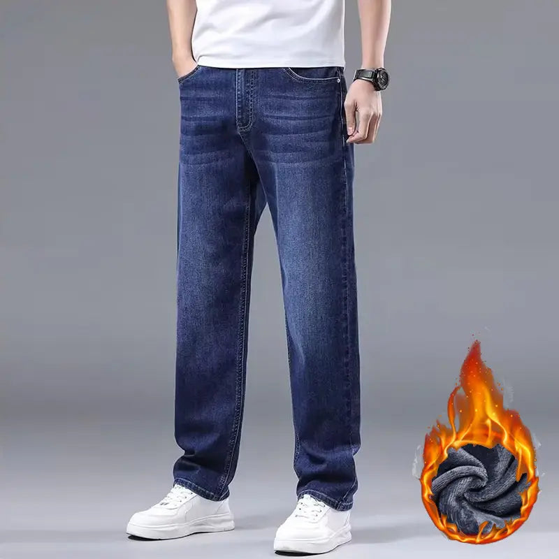 Men fleece lined winter jeans in dark blue denim with a loose straight-leg cut and visible stitching details.