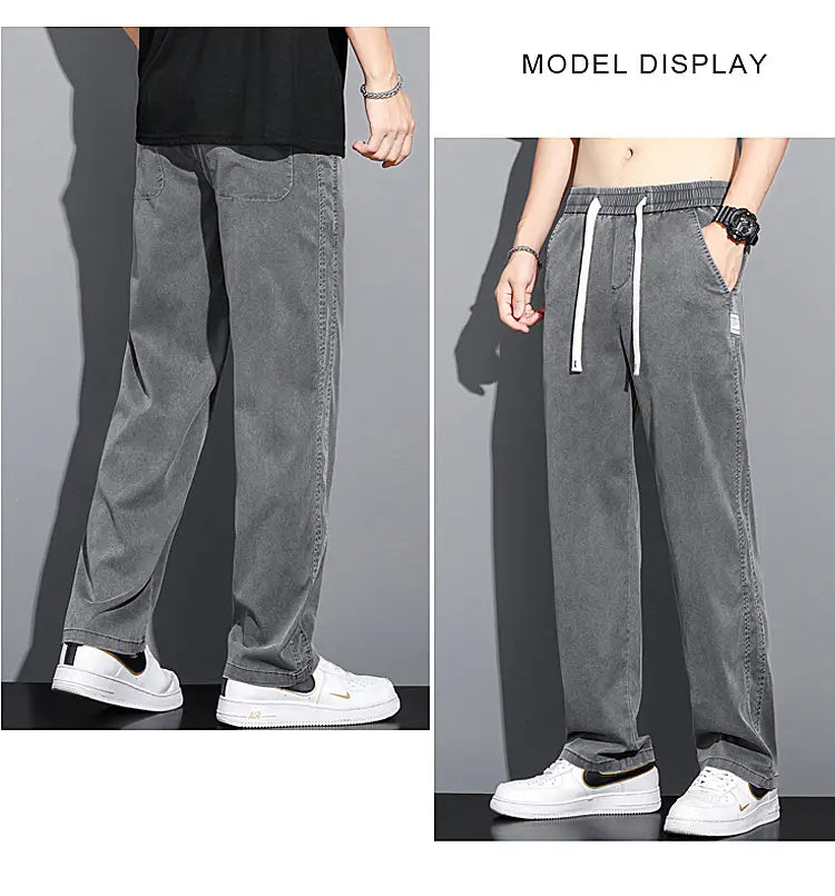 Men’s lyocell casual loose straight gray corduroy jogger pants with white drawstrings and a small logo patch on the thigh.