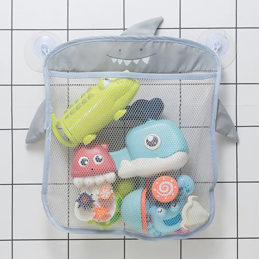 Sac de rangement pour jouets de bain en filet de forme requin gris, avec ventouses et des nageoires en tissu souple, pour l’organisation de la salle de bain.