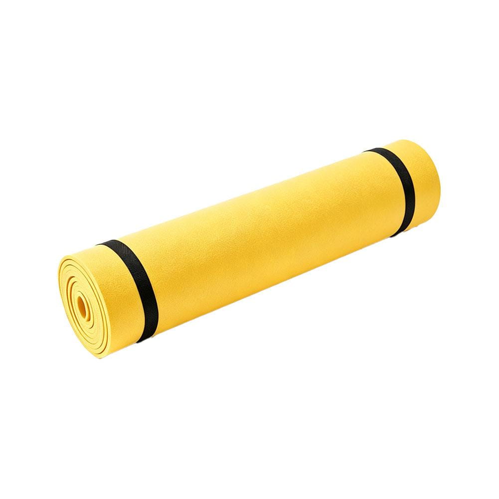 A bright yellow foldable Eva exercise mat for yoga and fitness rolled and secured with black straps.