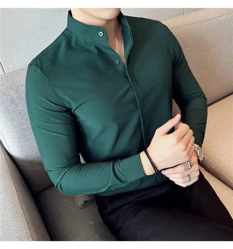 Dark green slim fit long-sleeved dress shirt with a stand collar and button-down front designed for men seeking formal wear in the correct size.