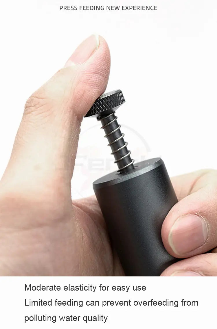 Black cylindrical feeder mini aquarium accessory with textured screw-top mechanism for dispensing small fish food.
