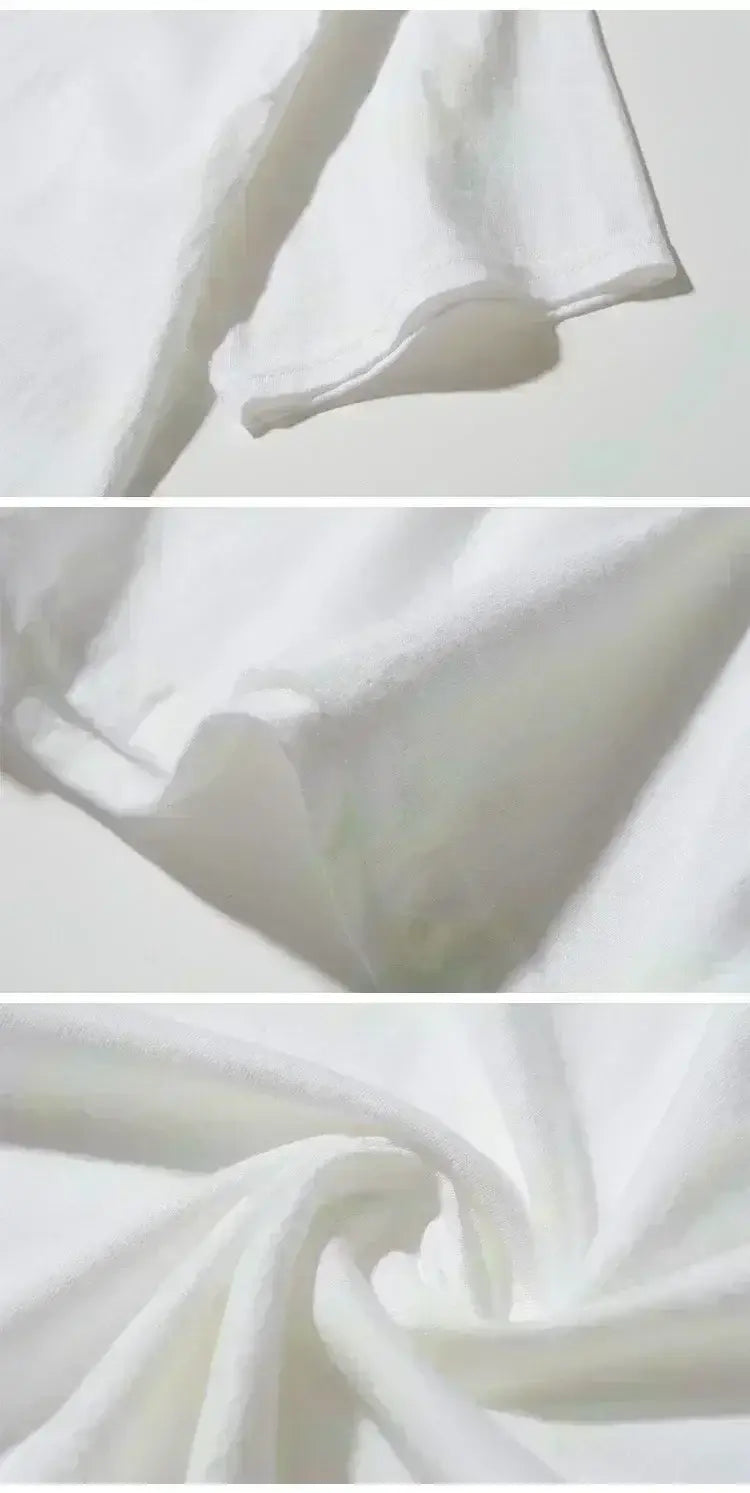 Graphic print oversized men short sleeve t shirt made of soft flowing white fabric with gentle folds and smooth texture.