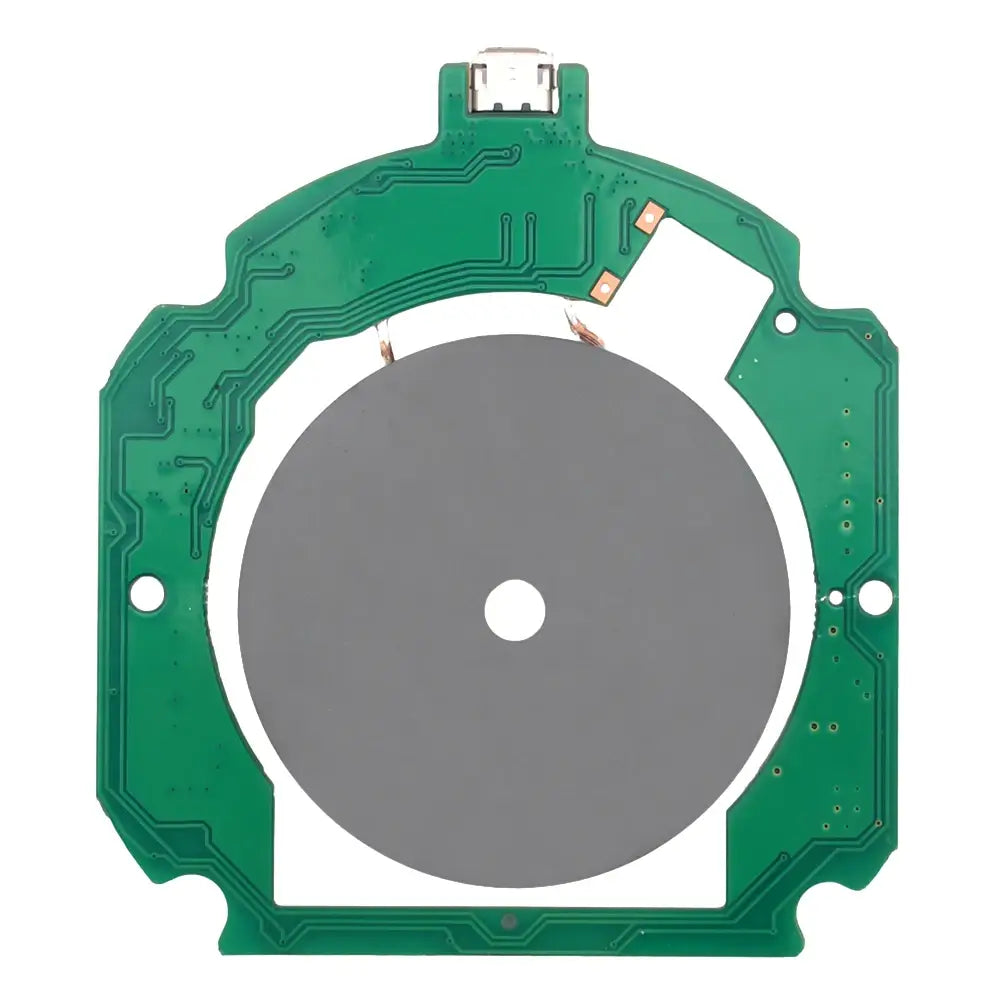 The picture shows a green wireless pcba circuit board with a circular gray component at its center designed for 15w fast charging transmitter module.