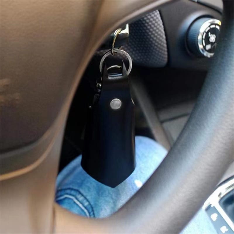 Batman leather keychain and card holder in black leather with a silver-toned metal ring and snap button.