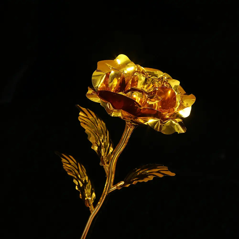 a golden rose crafted from metallic material with intricate lifelike petal details and a slender stem adorned with leaves for the gold foil artificial rose eternal gift flower product