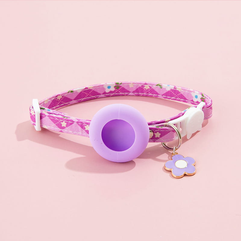 a pink floral-patterned airtag cat collar with a lavender silicone ring and matching flower-shaped charm featuring an airtag protective case for outdoor park dog and park dog cat use