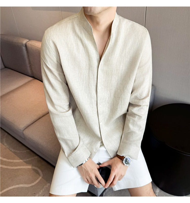 Beige men’s linen mandarin collar shirt with long sleeves and button-up front.