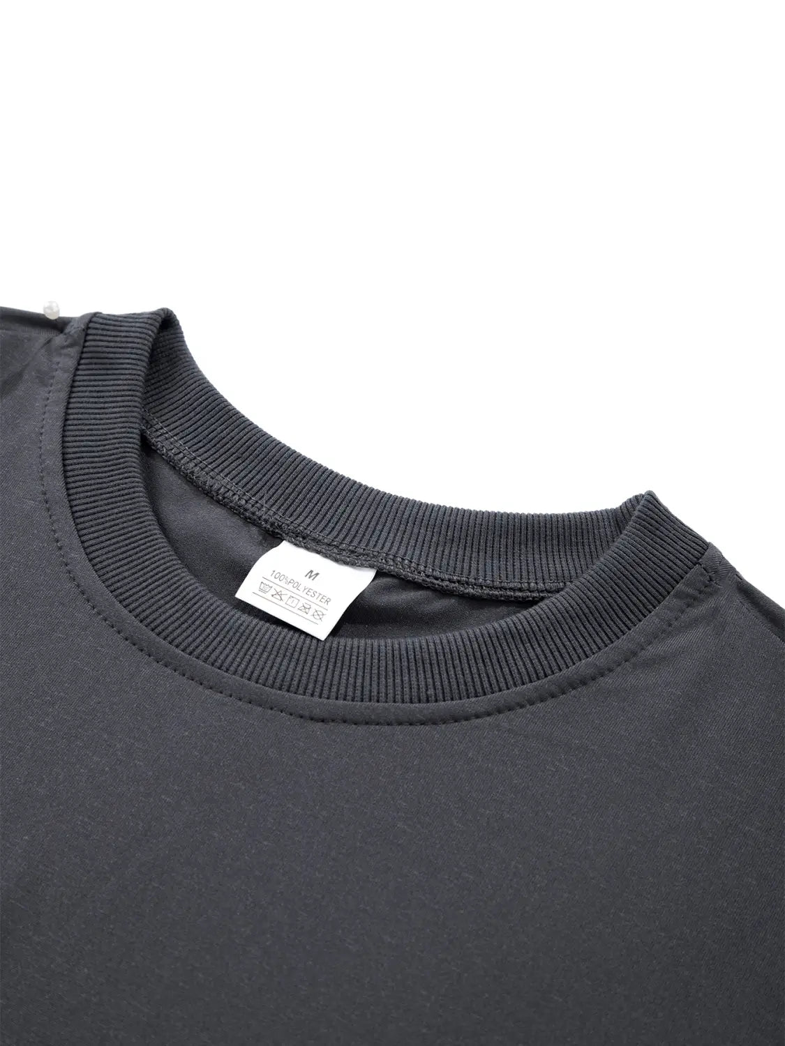 T-shirt à manches longues col rond à évacuation de l’humidité pour hommes, noir, en tissu côtelé, avec une étiquette d’entretien blanche à l’intérieur du col