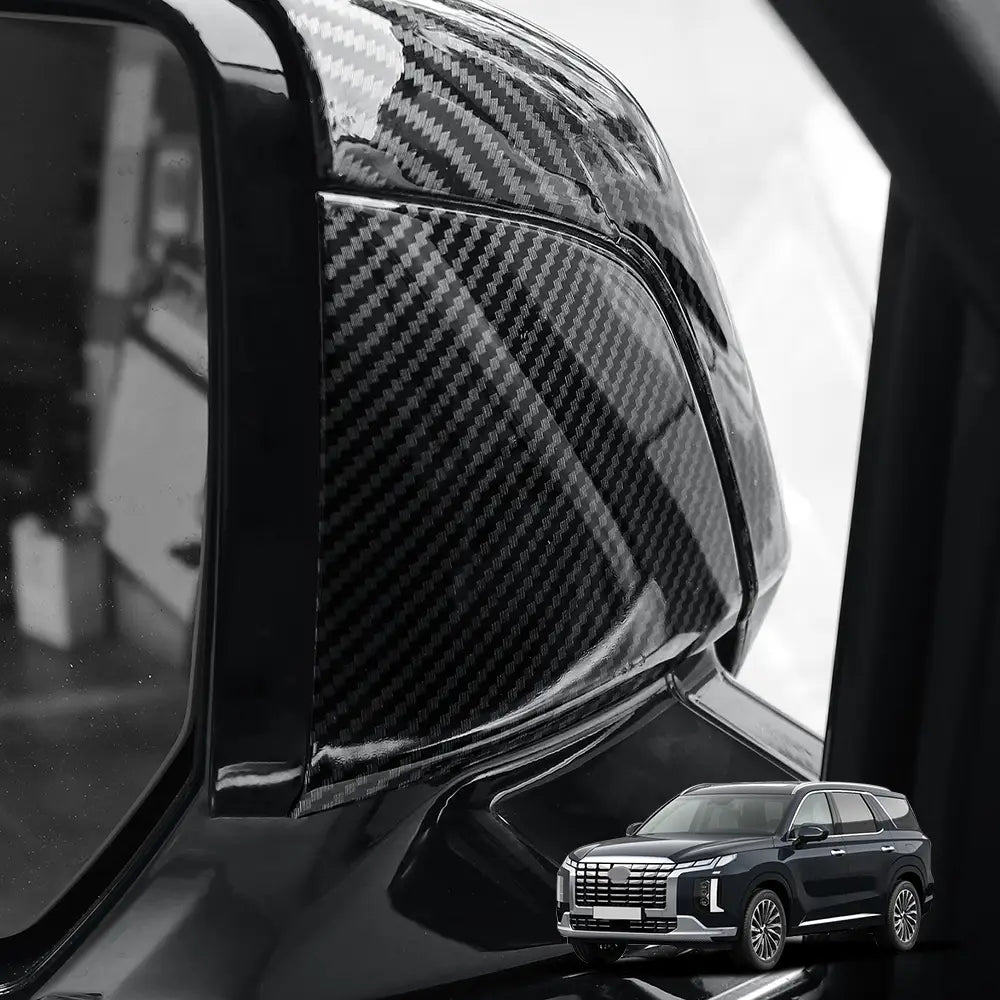Black carbon fiber textured side mirror cover for Hyundai Palisade led mirror covers 2020-2025 showing the back side of the product.