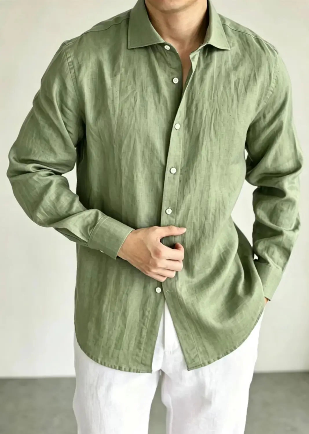 Men cotton linen casual button down shirt in olive green linen with a classic collar and long sleeves.
