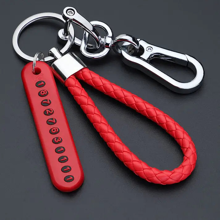 Red braided leather anti-lost stainless steel car key ring pendant with a silver-toned metal clasp and numbered tag.