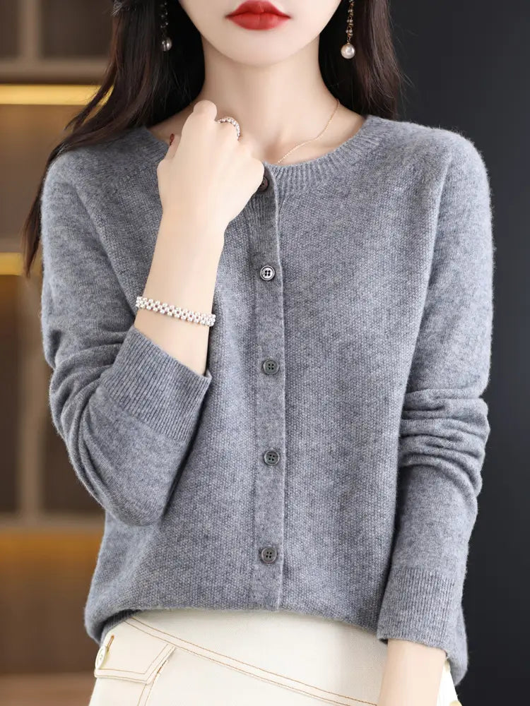 Gray merino wool knit cardigan for women featuring a round neckline and button closure in a cashmere blend.