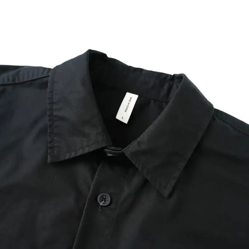 Men printed casual long sleeve shirt in black with a crisp collar and subtle stitching details.
