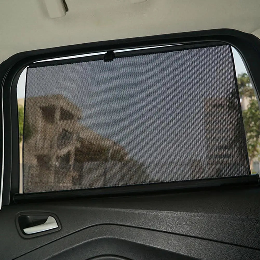 Black mesh retractable car window sunshade with a sleek frameless design providing UV protection.