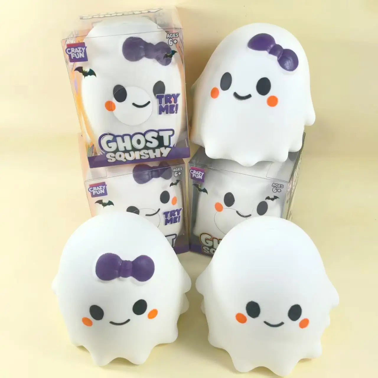 white ghost-shaped slow rising squishy stress relief toys with purple bows and orange cheeks designed by crazy fun