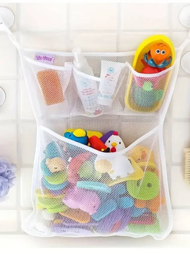 White mesh bath toy storage bag with suction cups featuring multiple compartments holding colorful bath toys and supplies.