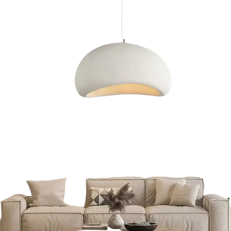 A dome-shaped pendant light with textured white exterior and warm glow for living room and dining room use