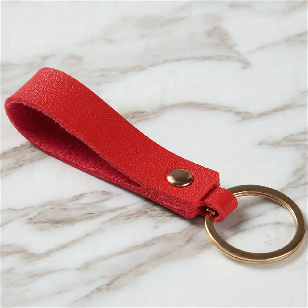 Red leather pu keychain with a gold-toned metal ring and snap button for fashion metal keyring use.