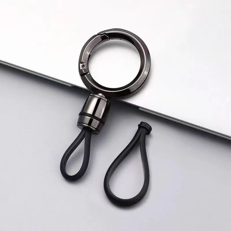 Mosquetón magnético de metal con llavero de goma negra, con anillo metálico pulido y conector cilíndrico diseñado para uso como anillo de llaves anti-pérdida.