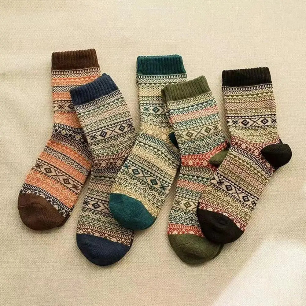 four pairs of men retro cotton crew socks featuring mid-high tube length in teal with cozy earthy tones, geometric patterns, and contrasting toe and heel colors, ideal for a fashion trend in thermal wear.