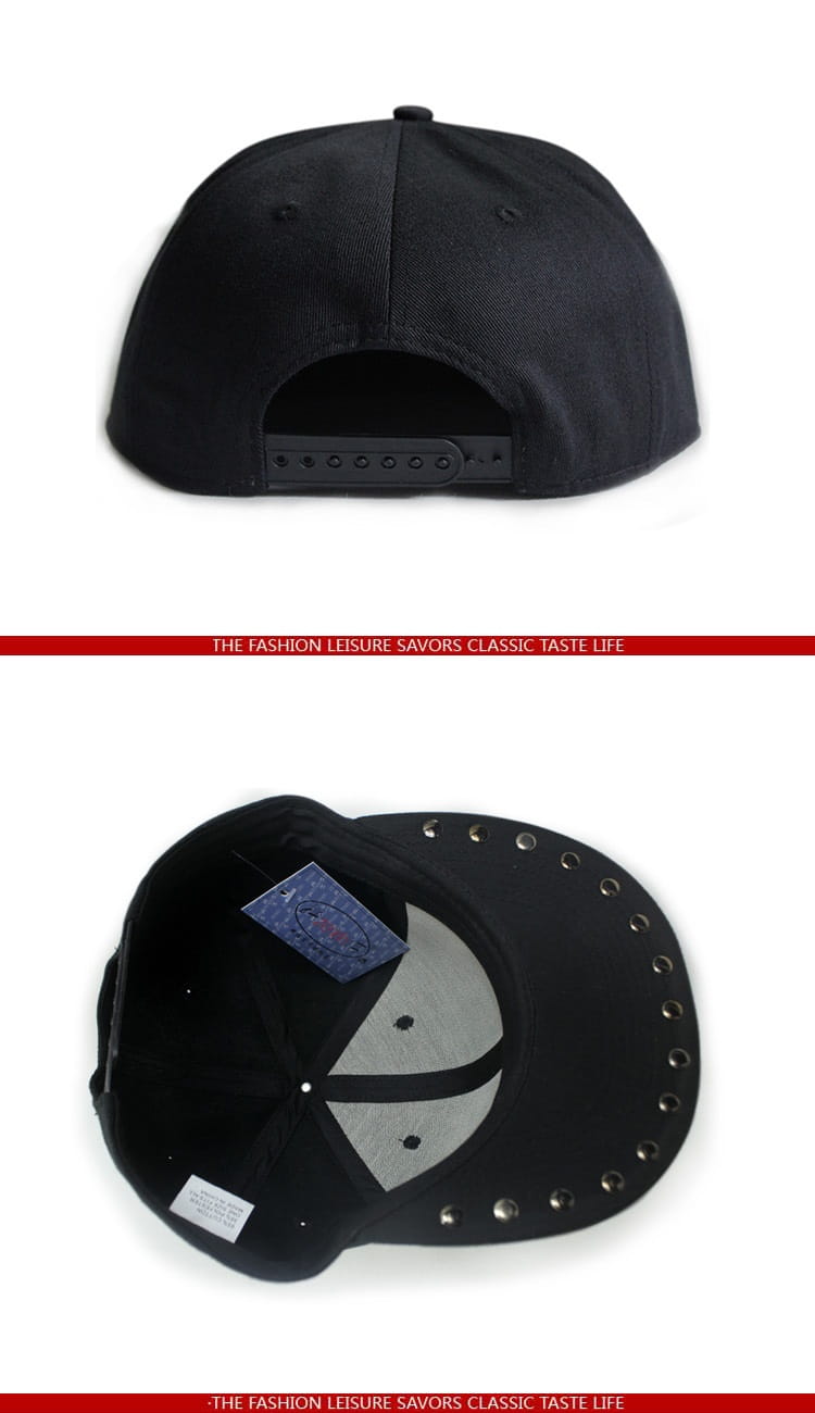 Black snapback baseball cap with gray sugar skull design and silver rivet studs along the brim.