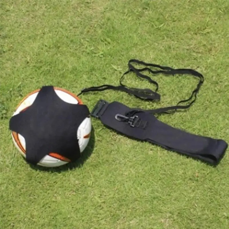 Black fabric solo football training aid featuring an adjustable waist belt with strap and buckle shown from the back side.