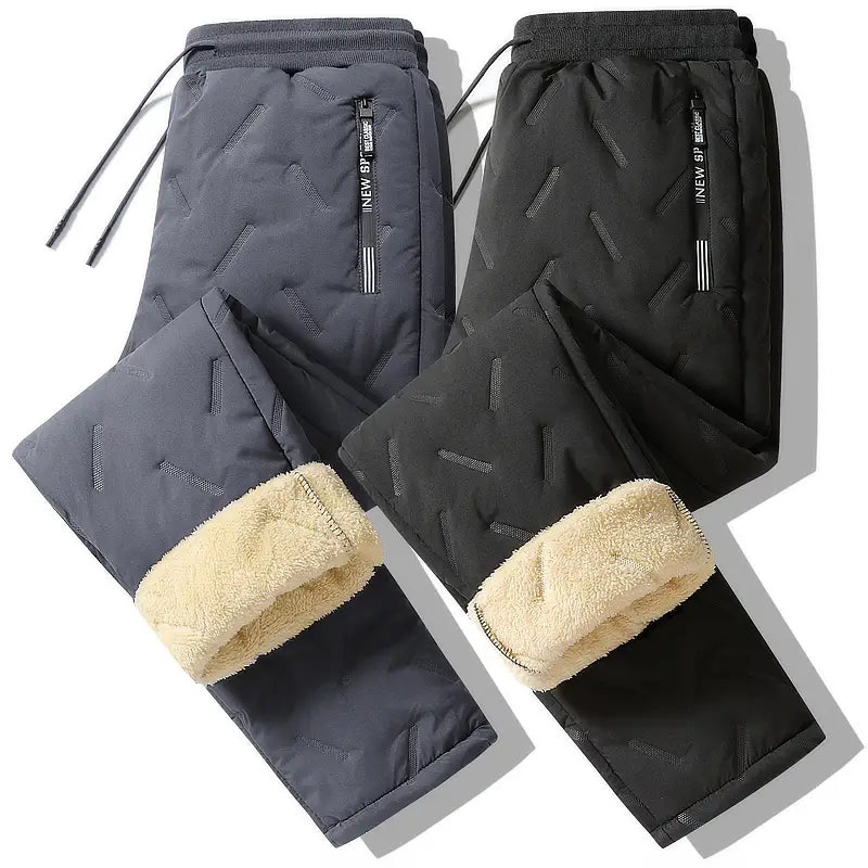 Men fleece lined thermal sweatpants in dark gray and black with quilted design and fleece-lined cuffs for winter wear.