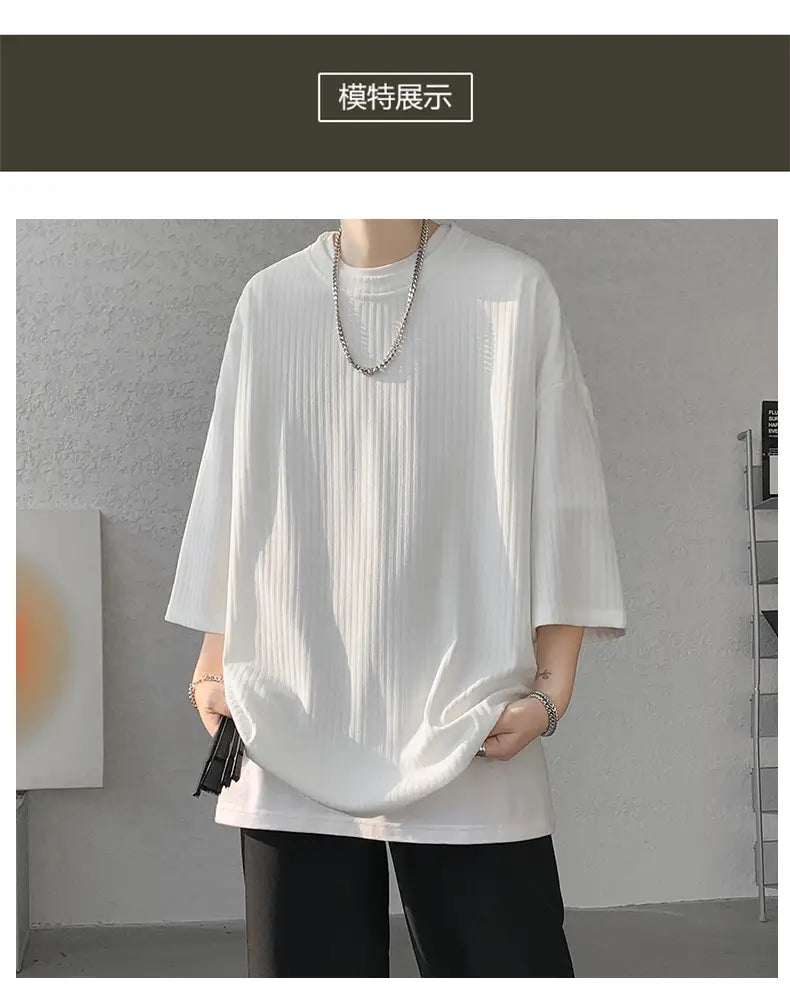 Men striped oversized summer t shirt featuring a white ribbed cotton fabric with a relaxed fit and three quarter sleeves.