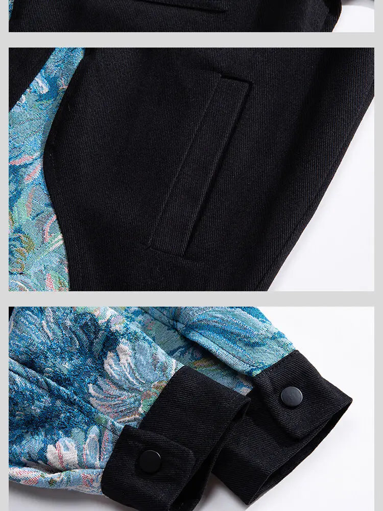 Schwarze Bomberjacke im Streetwear-Stil mit floraler Stickerei; mit einem blau floralen Muster-Paneel an der Seite sowie Ärmelbündchen mit schwarzen Knopfverschlüssen.