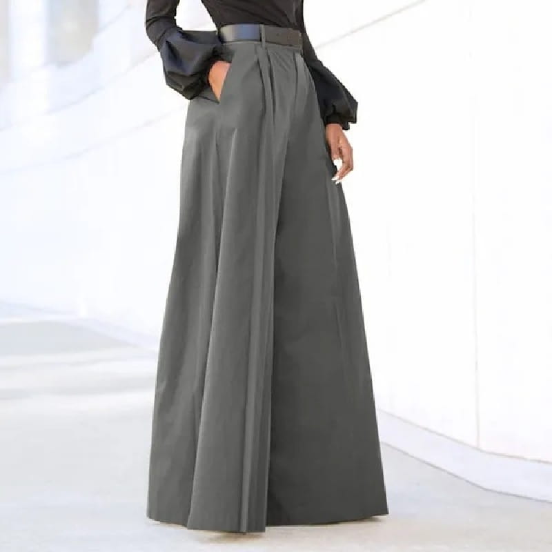 wide leg high waist tailored trousers in sleek charcoal gray fabric featuring a structured silhouette with prominent front pleats and a matching belt