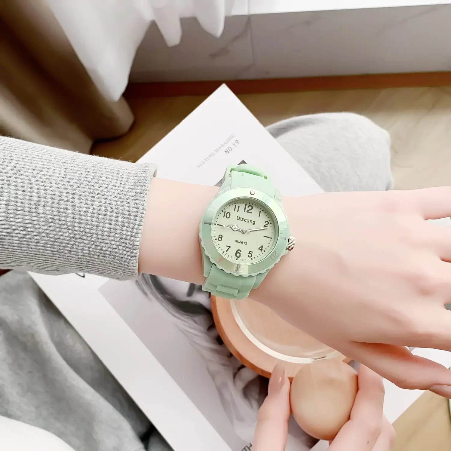 Mint green silicone kids quartz watch with white face and black numerals designed as a colorful jelly wristwatch.