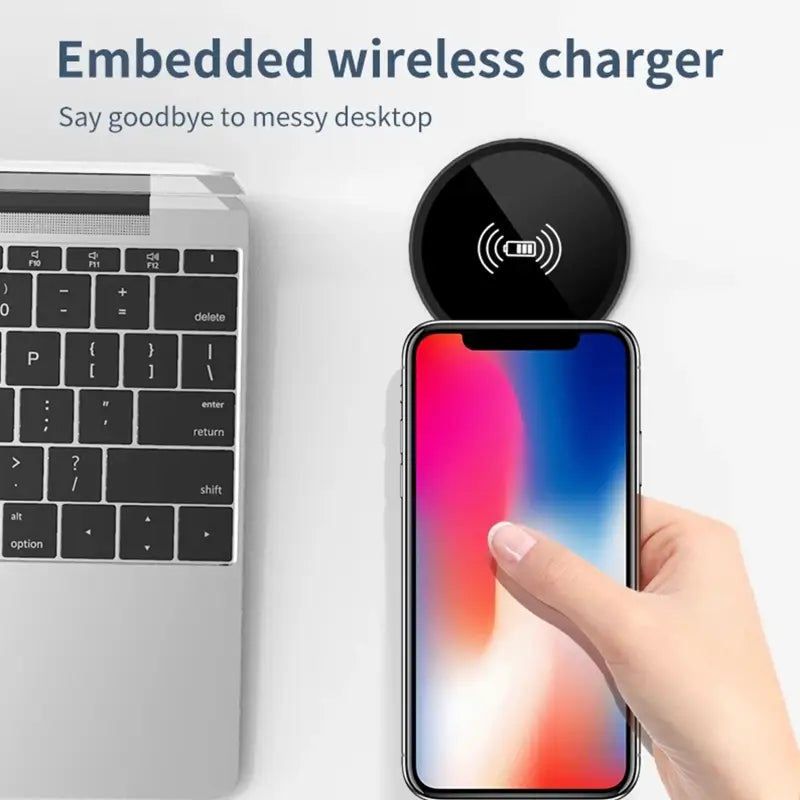 Black circular embedded desk wireless charger with a glossy finish and white charging symbol supporting fast 15w charging.