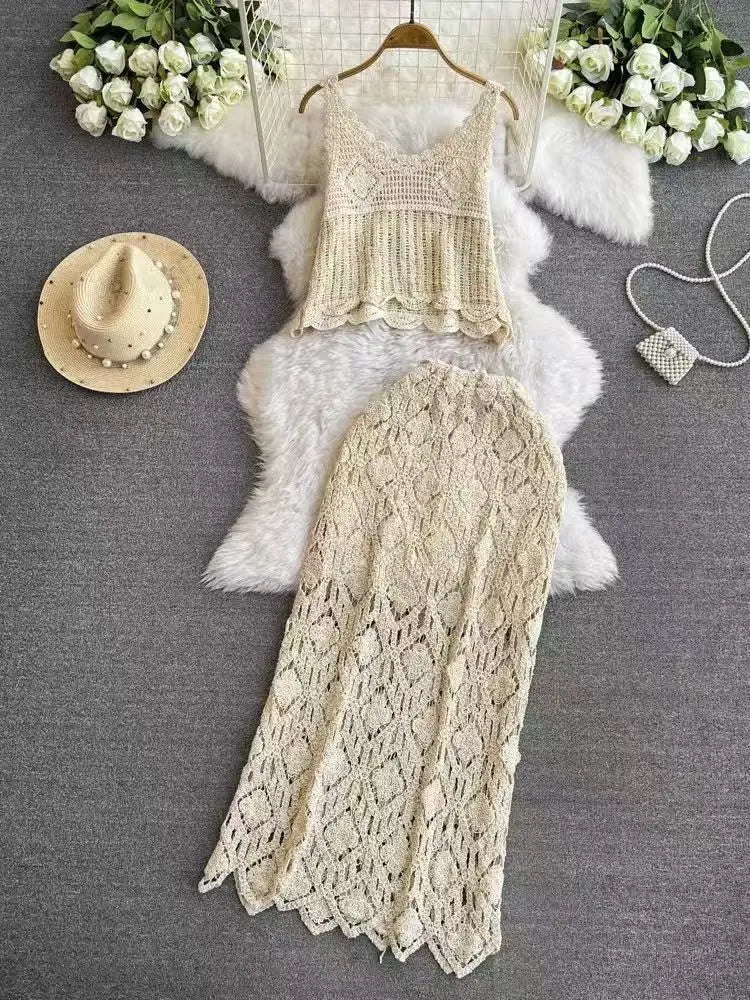 Cream-colored crochet lace maxi skirt two-piece set featuring a delicate textured top and matching high-waisted skirt with scalloped edges ideal for summer wear.